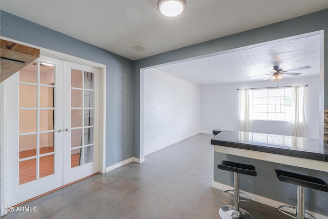 512 N Ironwood, Mesa, AZ 85201 - unfurnished dining area with french doors, concrete floors, a ceiling fan, and baseboards