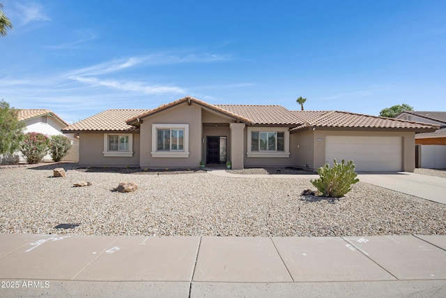 1231 E Sunburst Ln, Tempe, AZ 85284 - view of front facade with driveway, a garage, stucco siding, and a tile roof