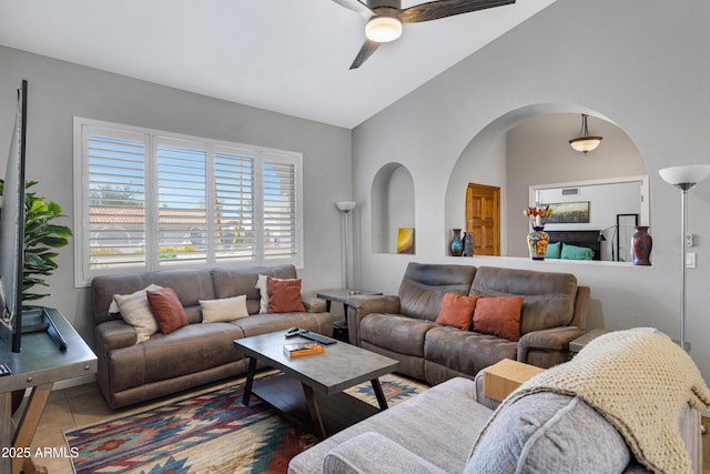 1231 E Sunburst Ln, Tempe, AZ 85284 - tiled living room with ceiling fan and arched walkways