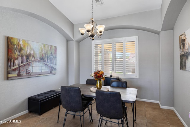 1231 E Sunburst Ln, Tempe, AZ 85284 - dining room with a chandelier, tile patterned flooring, and baseboards