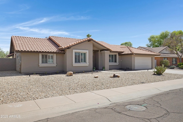 1231 E Sunburst Ln, Tempe, AZ 85284 - view of front facade with stucco siding, a tiled roof, an attached garage, and concrete driveway
