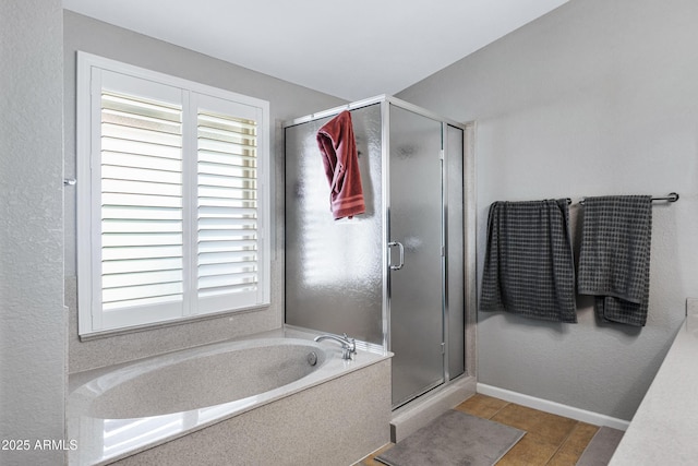 1231 E Sunburst Ln, Tempe, AZ 85284 - bathroom with a shower stall, a garden tub, healthy amount of natural light, and baseboards