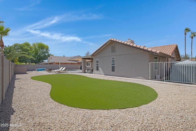 1231 E Sunburst Ln, Tempe, AZ 85284 - rear view of property with a patio, a fenced backyard, a tile roof, and stucco siding
