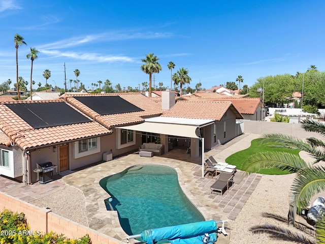 1231 E Sunburst Ln, Tempe, AZ 85284 - view of swimming pool with an outdoor living space, area for grilling, a fenced backyard, and a patio