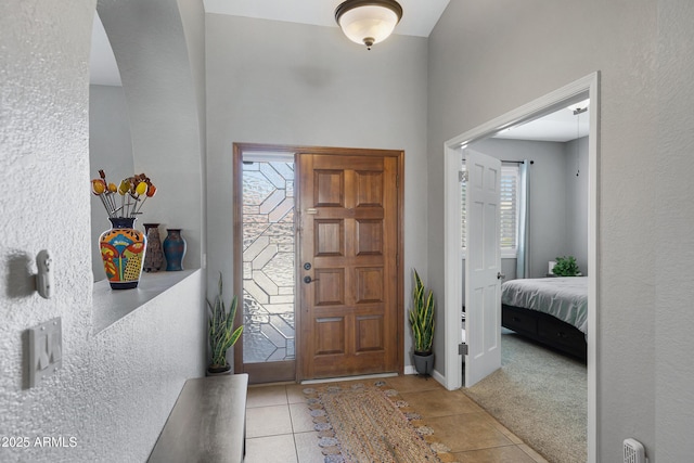 1231 E Sunburst Ln, Tempe, AZ 85284 - tiled entrance foyer with arched walkways and carpet