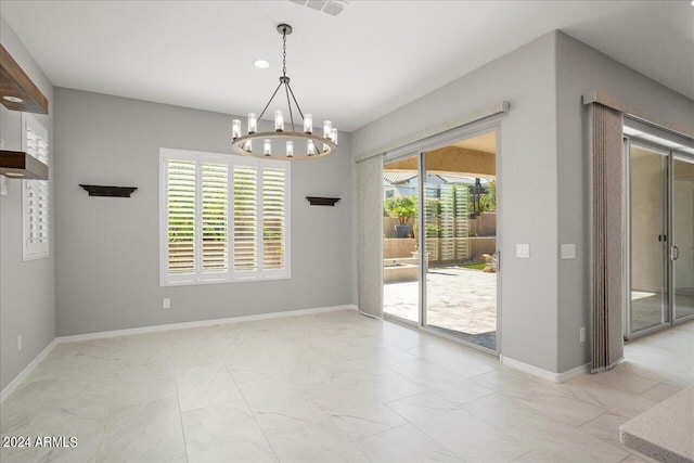 unfurnished dining area featuring a notable chandelier and light tile patterned floors