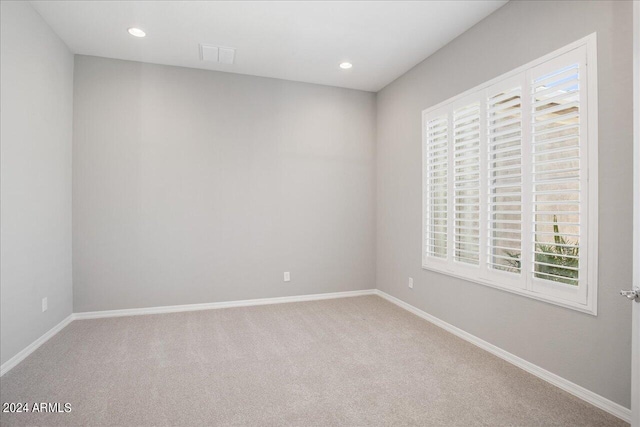 unfurnished room featuring carpet flooring