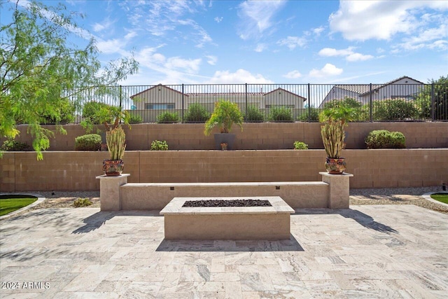 view of patio with a fire pit