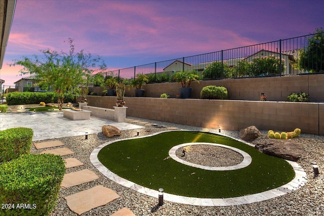 yard at dusk with a patio