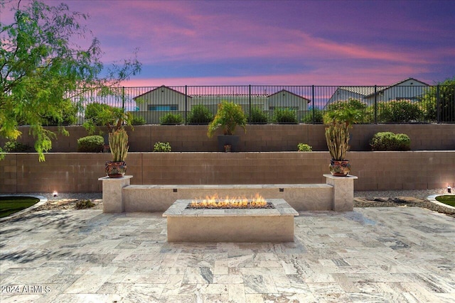 patio terrace at dusk with an outdoor fire pit