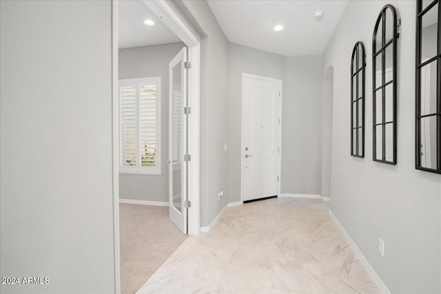 entrance foyer featuring light carpet