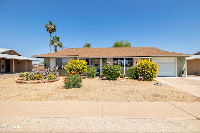 ranch-style home with a garage