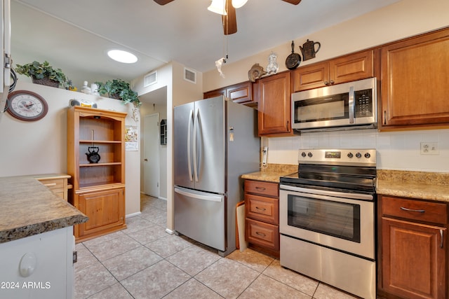 kitchen featuring backsplash, appliances with stainless steel finishes, ceiling fan, and light tile floors