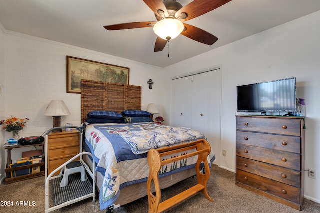 bedroom with a closet, ceiling fan, and dark carpet