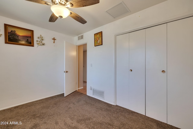 unfurnished bedroom with carpet flooring, a closet, and ceiling fan