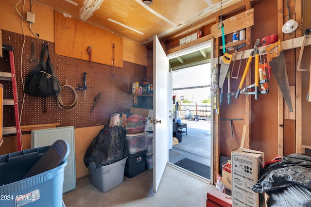 misc room featuring concrete floors and a workshop area