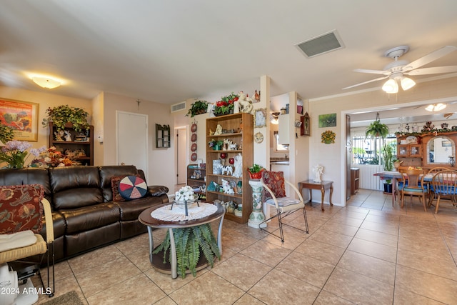 tiled living room with ceiling fan