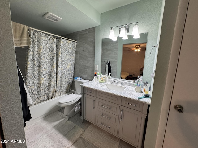 full bathroom featuring shower / tub combo, a textured ceiling, vanity, tile patterned flooring, and toilet