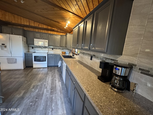 kitchen featuring white appliances, vaulted ceiling, sink, wooden ceiling, and dark hardwood / wood-style floors