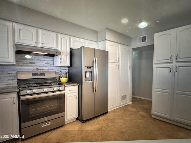 6111 N 64th Dr, Glendale, AZ 85301 - kitchen featuring stainless steel appliances, under cabinet range hood, light tile patterned flooring, and white cabinetry