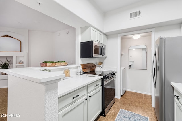 kitchen with kitchen peninsula, white cabinetry, stainless steel appliances, and light tile patterned floors