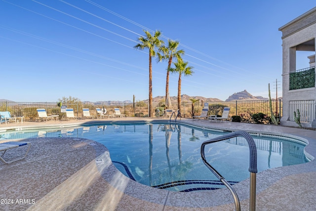 10401 N Saguaro Blvd Unit 224, Fountain Hills, AZ 85268 - community pool with fence, a patio area, and a mountain view