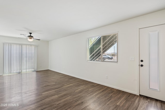 unfurnished room featuring ceiling fan and dark hardwood / wood-style floors