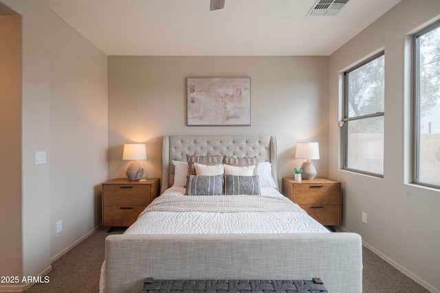 carpeted bedroom featuring visible vents and baseboards