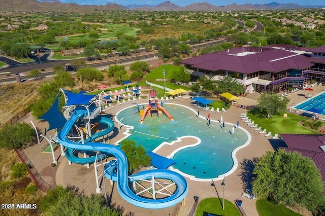 birds eye view of property with a mountain view