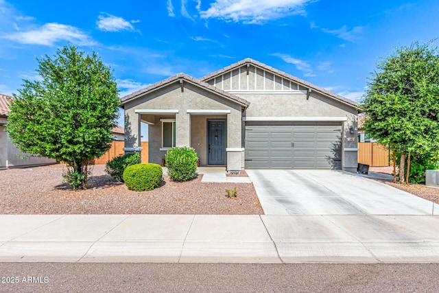 7910 S 33rd Ln, Laveen, AZ 85339 - view of front of house with a garage, stucco siding, concrete driveway, covered porch, and a tiled roof