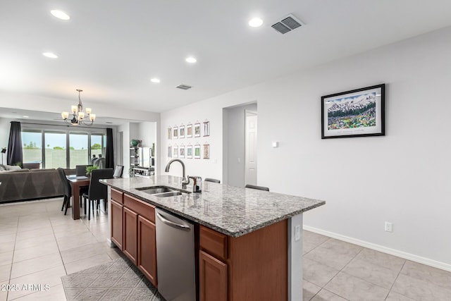 7910 S 33rd Ln, Laveen, AZ 85339 - kitchen featuring dishwasher, a chandelier, open floor plan, light stone countertops, and light tile patterned floors
