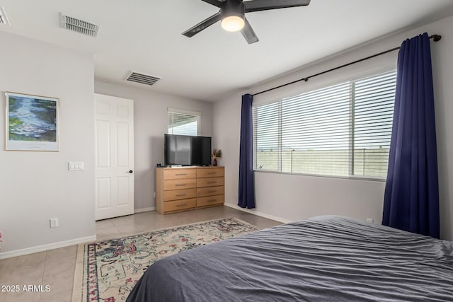 7910 S 33rd Ln, Laveen, AZ 85339 - bedroom with light tile patterned floors and a ceiling fan