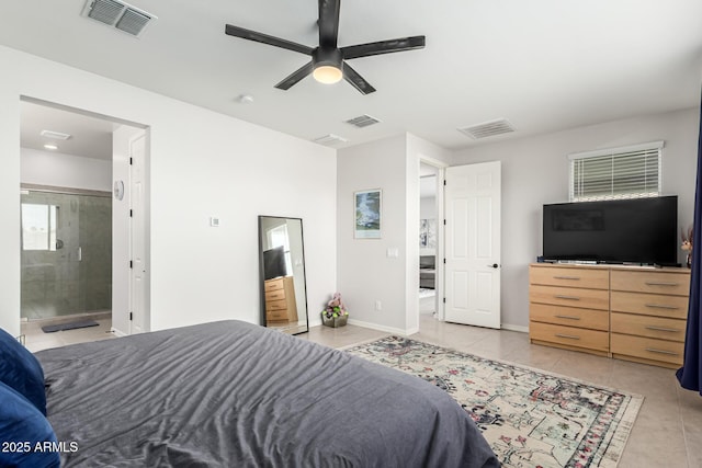 7910 S 33rd Ln, Laveen, AZ 85339 - bedroom with light tile patterned floors, ceiling fan, and ensuite bathroom
