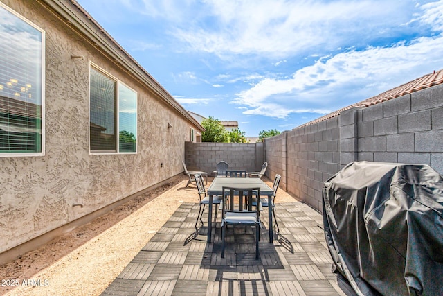 7910 S 33rd Ln, Laveen, AZ 85339 - fenced backyard featuring outdoor dining space, a patio, and grilling area