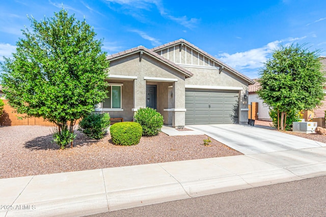 7910 S 33rd Ln, Laveen, AZ 85339 - view of front of home featuring stucco siding, an attached garage, concrete driveway, and a tiled roof