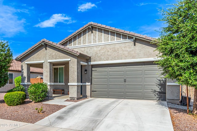 7910 S 33rd Ln, Laveen, AZ 85339 - view of front facade with driveway, stucco siding, an attached garage, and a tiled roof