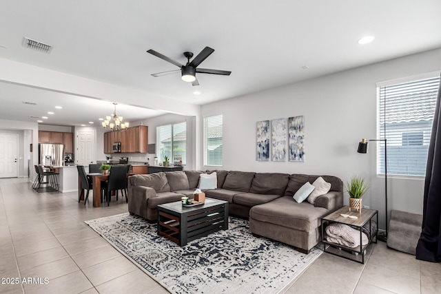 7910 S 33rd Ln, Laveen, AZ 85339 - living room featuring ceiling fan, a chandelier, recessed lighting, and light tile patterned flooring