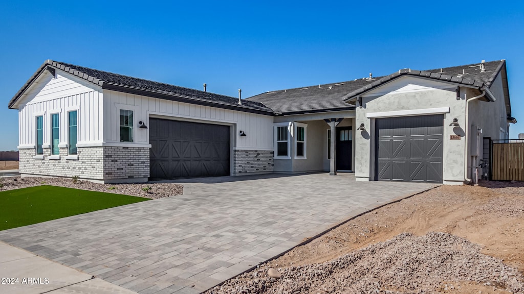 ranch-style house featuring a garage