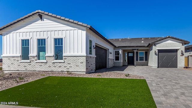 exterior space with a front lawn and a garage