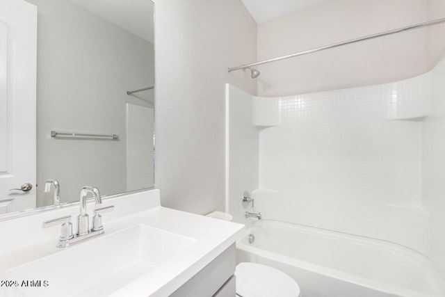 full bathroom featuring vanity, toilet, and shower / washtub combination