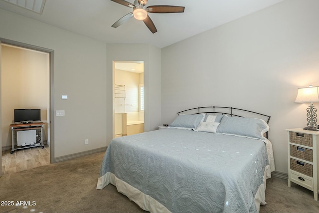 bedroom featuring ceiling fan, ensuite bath, and carpet