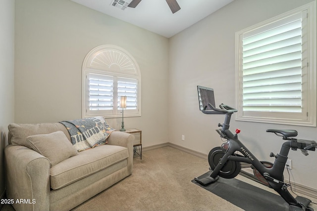 exercise area with lofted ceiling, light carpet, and ceiling fan