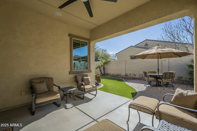 view of patio with ceiling fan