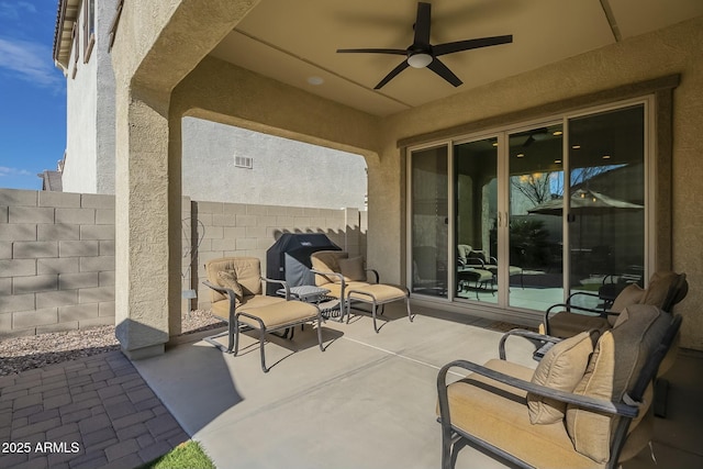 view of patio / terrace with grilling area and ceiling fan