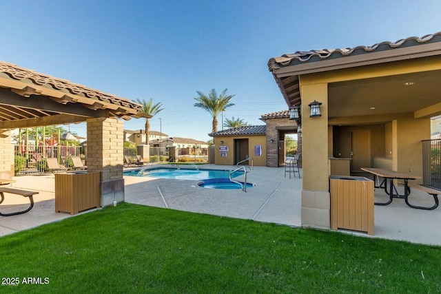 view of pool with a yard and a patio