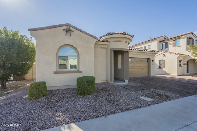 mediterranean / spanish house featuring a garage