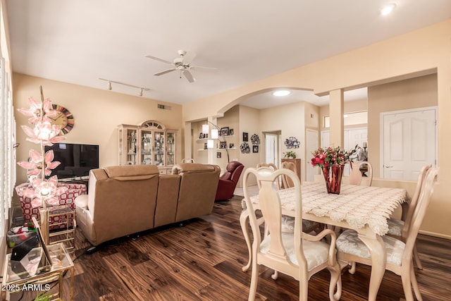 dining space featuring ceiling fan, dark hardwood / wood-style floors, and track lighting