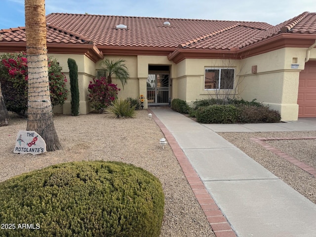 mediterranean / spanish-style house featuring a garage