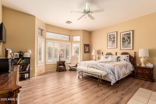 bedroom featuring ceiling fan and light hardwood / wood-style floors