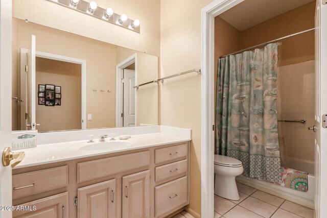 full bathroom with tile patterned floors, toilet, vanity, and shower / bath combo